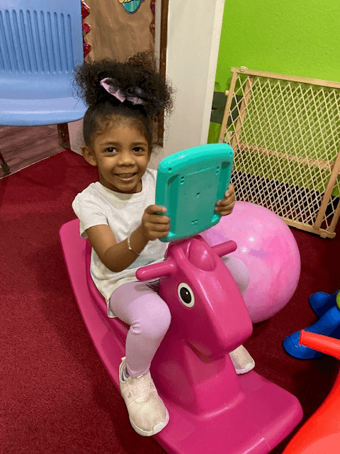 All smiles on the rocking horse